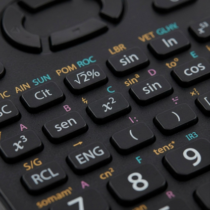 An extreme macro photograph capturing the precise, multi-colored button labels and complex display of the Sharp EL520XTBK.