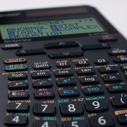 Macro close-up of a SHARP ELW516XGSL calculator's matrix display and function keys, highlighting the dot-matrix quality.