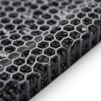 Extreme macro photo showing the precision hexagon honeycomb structure, fine filter mesh, and densely packed activated carbon granules of the FZK50DFU filter.