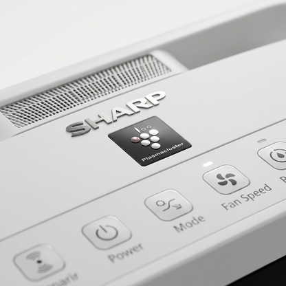 Detail close-up of sharp air purifier control panel with Plasmacluster indicator and SHARP logo.