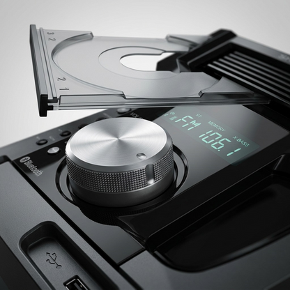 Macro photograph of the SHARP CD-BH950 multi-disc mechanism and volume knob.