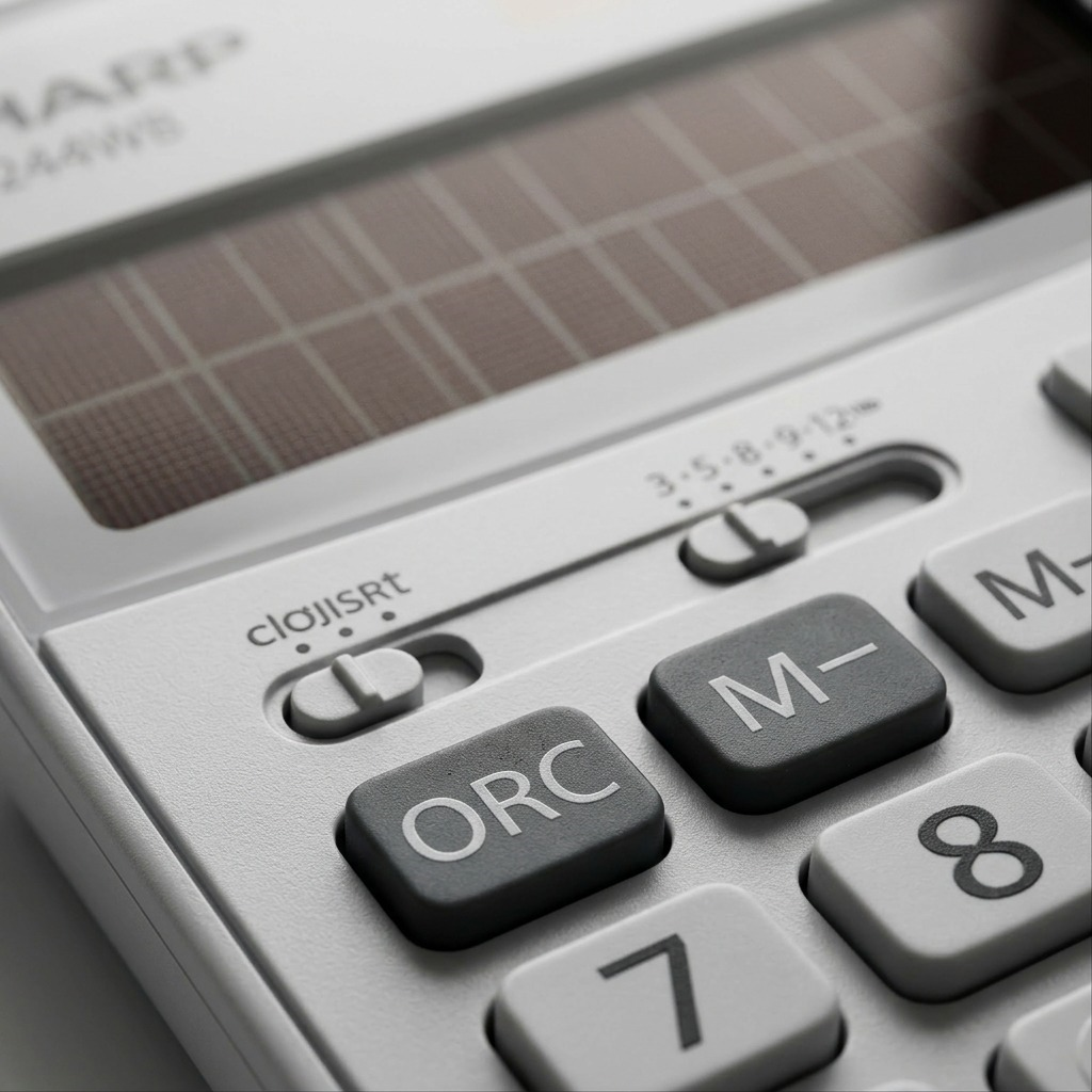Extreme calculator close-up on solar panel, textured buttons, M- and ORC controls.