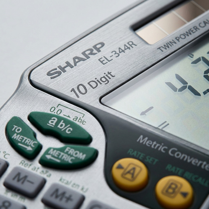 Macro detail of the Sharp EL344R calculator showcasing the texture and print of conversion keys.