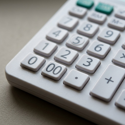 A close-up photograph of a calculator with clear white keys and small black text