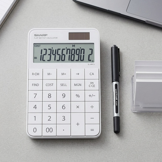 A top-down photograph comparing the white SHARP EL-VM73WH calculator to a pen for scale.