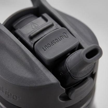 A macro photo of the dark gray Contigo Autospout water bottle, highlighting the AUTOSPOUT pop-up button.