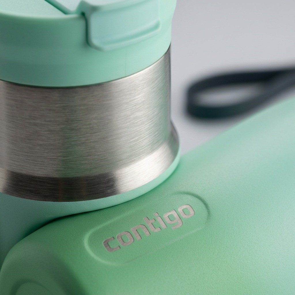 A macro photo of the Contigo Tween bottle, showing metal texture, the ombre finish, and the etched logo.
