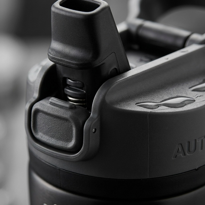 Macro photo detailing the Contigo water bottle's AUTOSEAL mechanism, button, and spout textures.